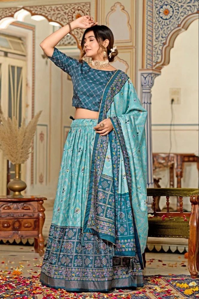 Embrace the elegance of Dola Silk, where tradition meets contemporary style in every printed lehenga choli